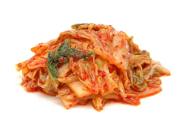 A serving of kimchi, a traditional Korean fermented vegetable dish made from cabbage and seasoned with spices.