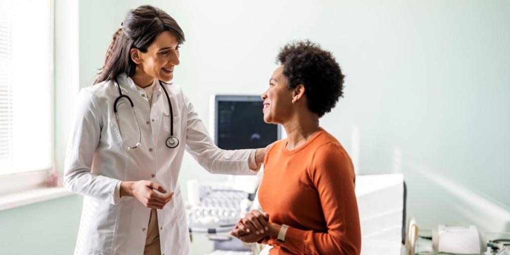 VA clinician speaking with a patient during a clinic visit, representing ambient AI scribe technology in veteran care.